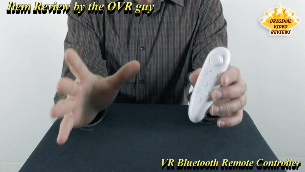 The OVR Guy holding the VR Bluetooth Remote Controller in one hand during the review