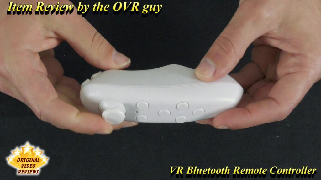 The OVR Guy holding the VR Bluetooth Remote Controller in a close-up shot