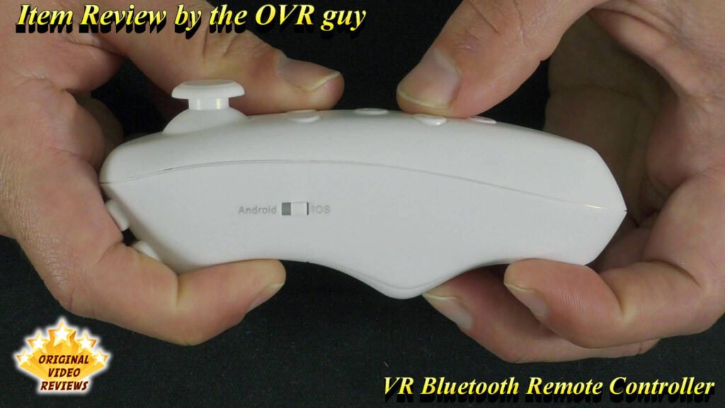 The OVR Guy holding the VR Bluetooth Remote Controller in a close-up side view