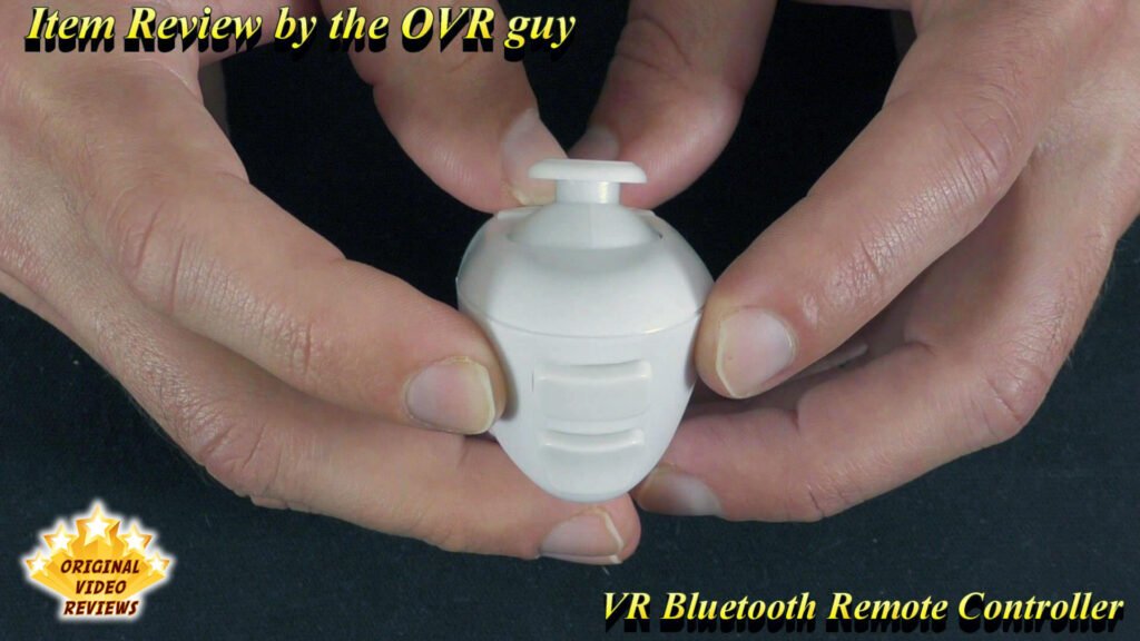 The OVR Guy holding the VR Bluetooth Remote Controller close to the camera, showing its front side in detail