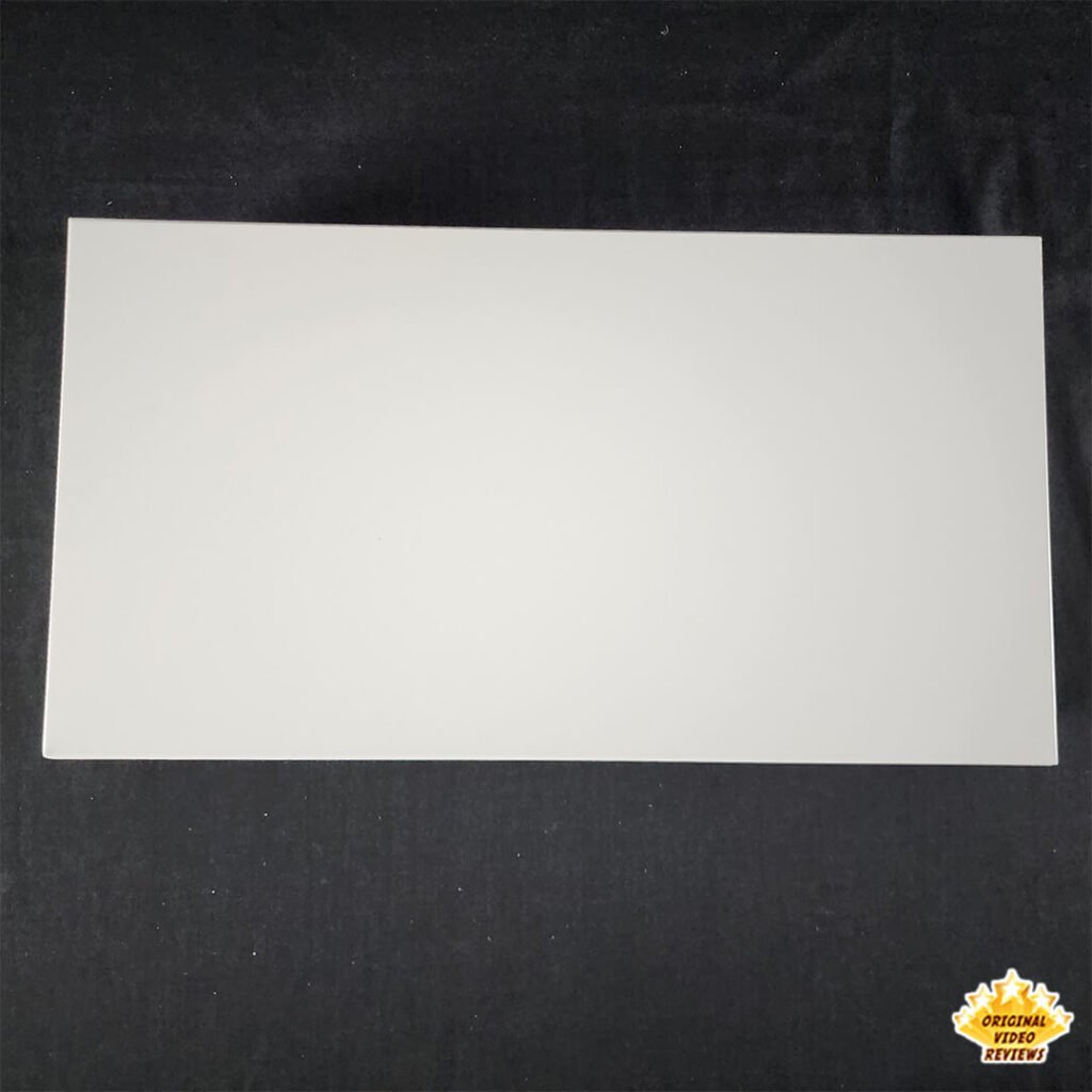 Top-down view of the IKEA ELLOVEN Monitor Stand with Drawer, showing the smooth white surface.