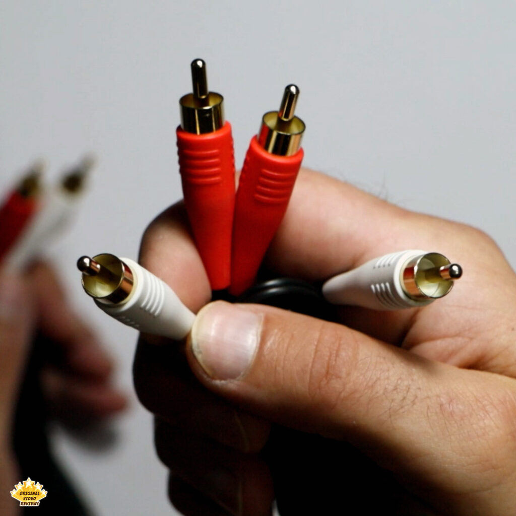 Close-up of the dual-sided RCA cable (red and white connectors) included with the Edifier T5 – shown in the OVR review