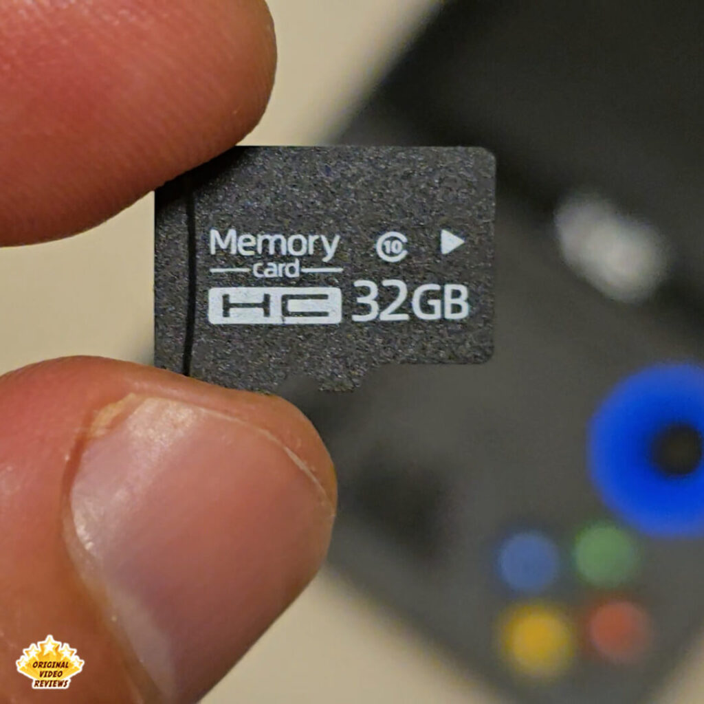 Close-up of a 32GB microSD memory card included with the X6 handheld gaming console