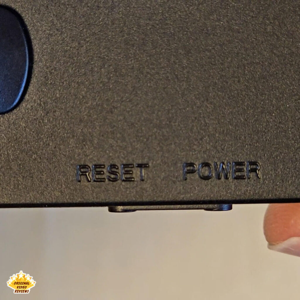 Close-up of the RESET and POWER buttons on the X6 handheld gaming console