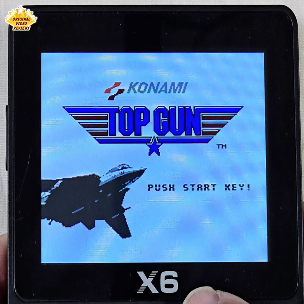 X6 handheld console showing the Top Gun title screen by Konami with OVR's Original Video Reviews logo on the top-left corner.