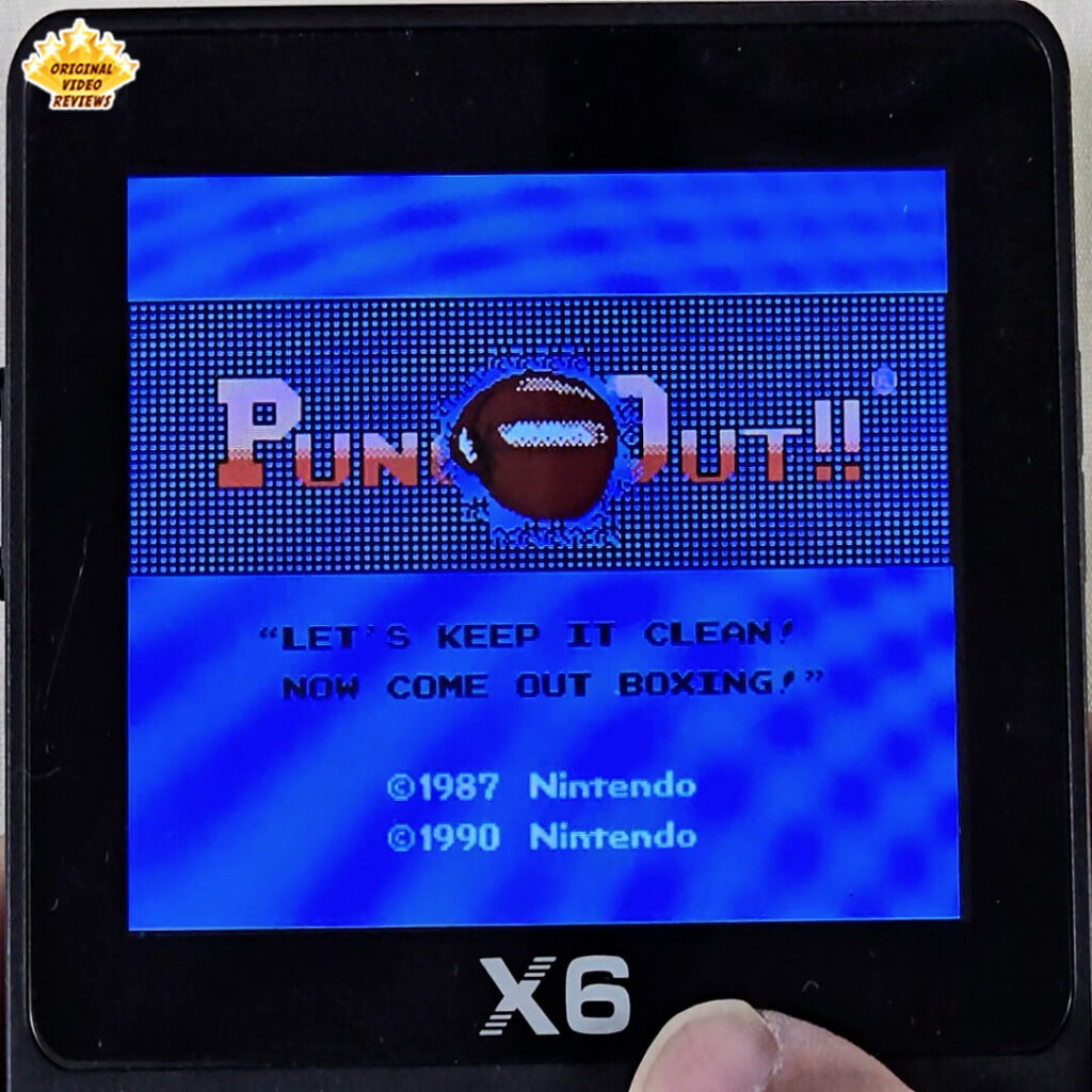 X6 handheld console showing Punch-Out!! title screen with OVR's Original Video Reviews coverage logo on the top-left corner.
