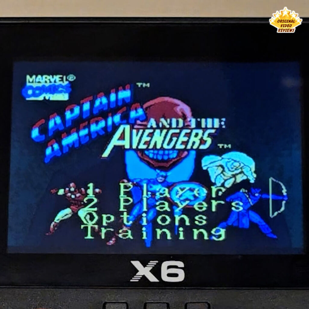 Close-up of the X6 handheld retro gaming console displaying the title screen of "Captain America and The Avengers," featuring Marvel superheroes and villains.