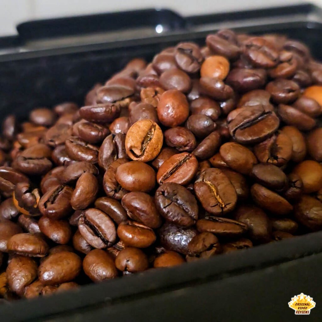 Close-up of Bristot Classico Oro coffee beans inside the grinder compartment of a BEANS fully automatic espresso machine, ready for the first brew.