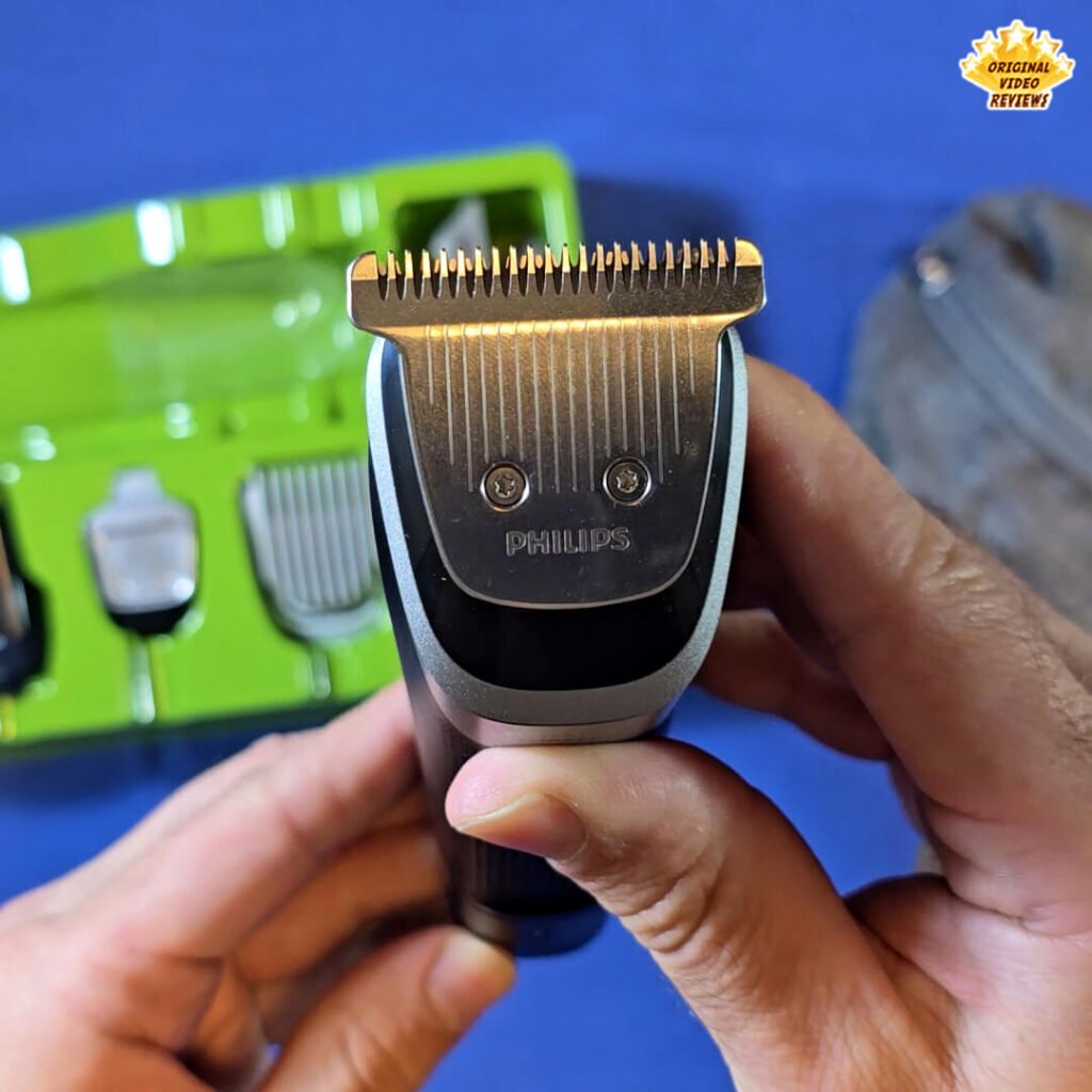 Close-up of the wide metal trimmer head attached to the Philips Norelco Multigroom 5000 MG5970/49, held by the OVR Guy during the review.