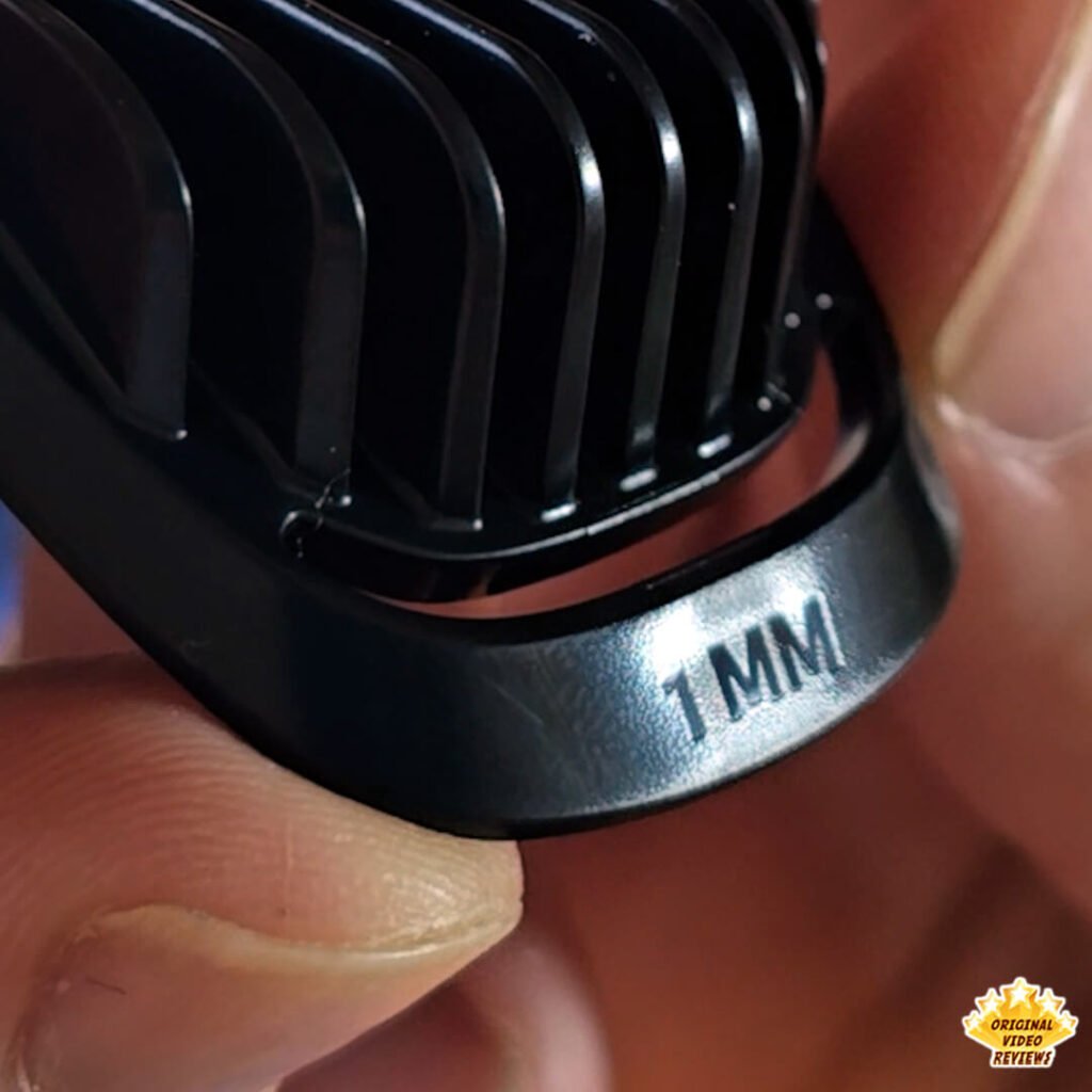 Close-up of the 1 mm stubble comb from the Philips Norelco Multigroom 5000 MG5970/49 grooming kit.