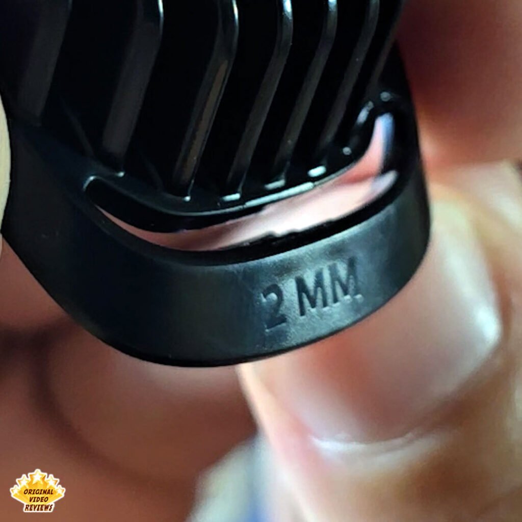 Close-up of the 2 mm stubble comb from the Philips Norelco Multigroom 5000 MG5970/49 grooming kit.