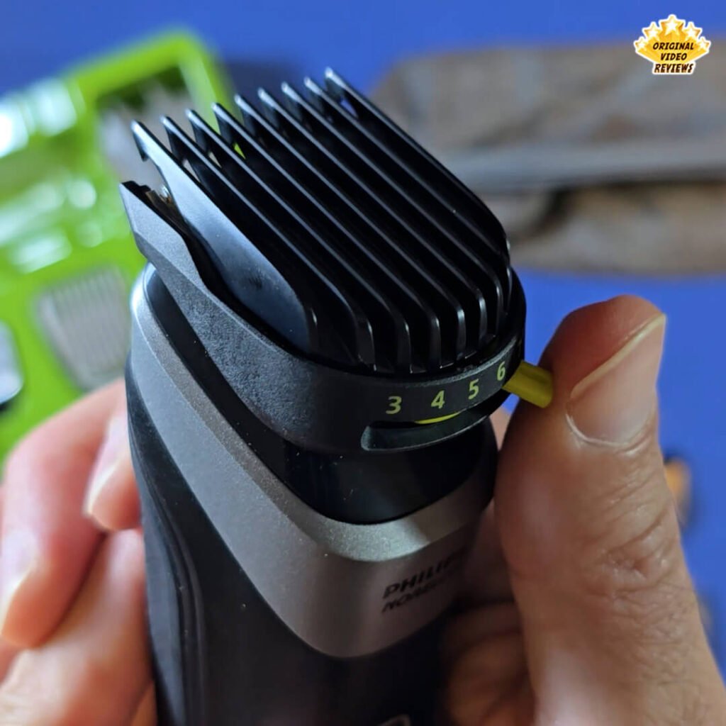 Close-up of the Philips Norelco Multigroom 5000 MG5970/49 with the adjustable 3–7 mm hair comb attached, showing the lime green sliding lever set to position 5.