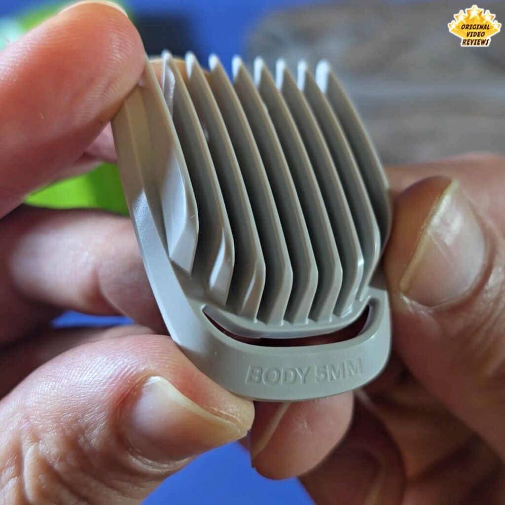 Close-up of the Philips Norelco Multigroom 5000 5 mm body guard comb attachment labeled “BODY 5 MM.”