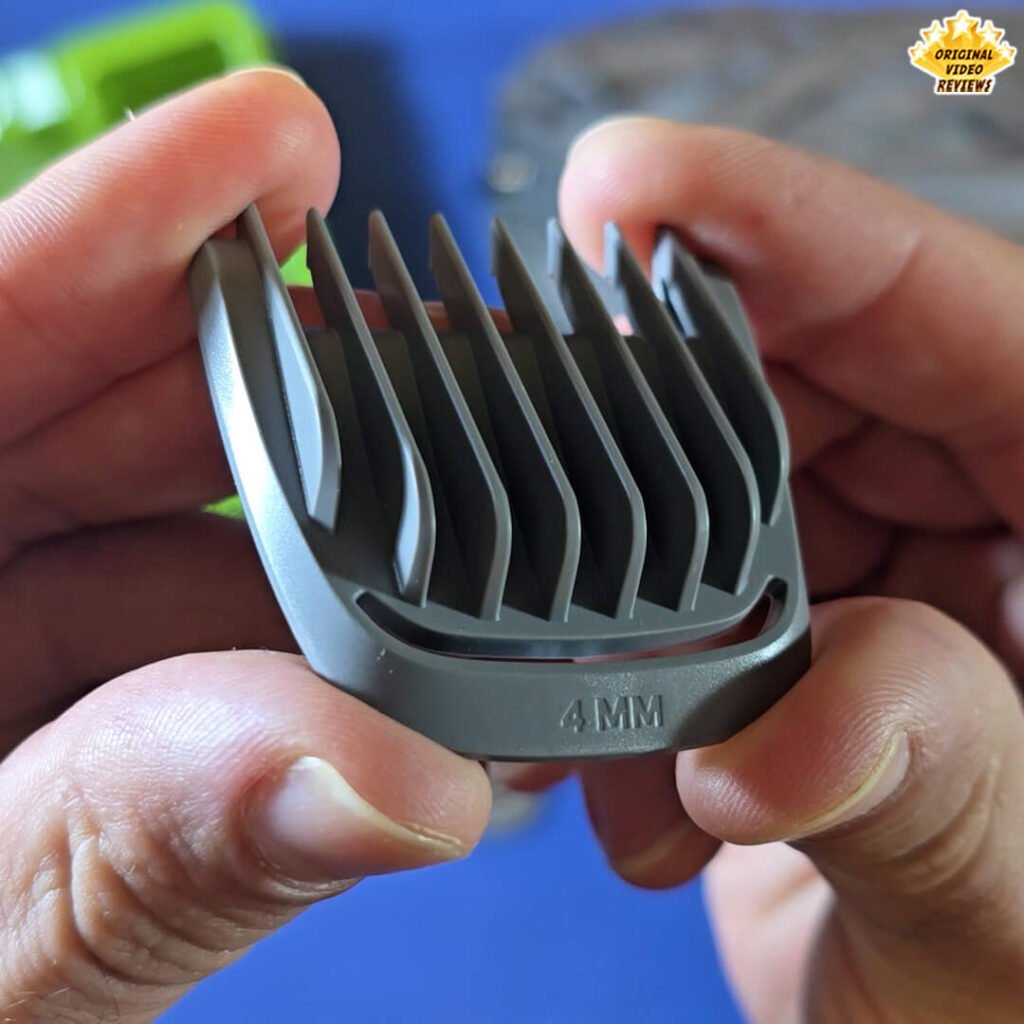 Close-up of the Philips Norelco Multigroom 5000 4 mm hair comb attachment labeled “4 MM.”