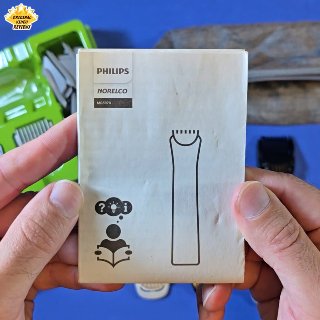 Close-up of the Philips Norelco Multigroom 5000 user manual (model MG5970) held by the OVR Guy.