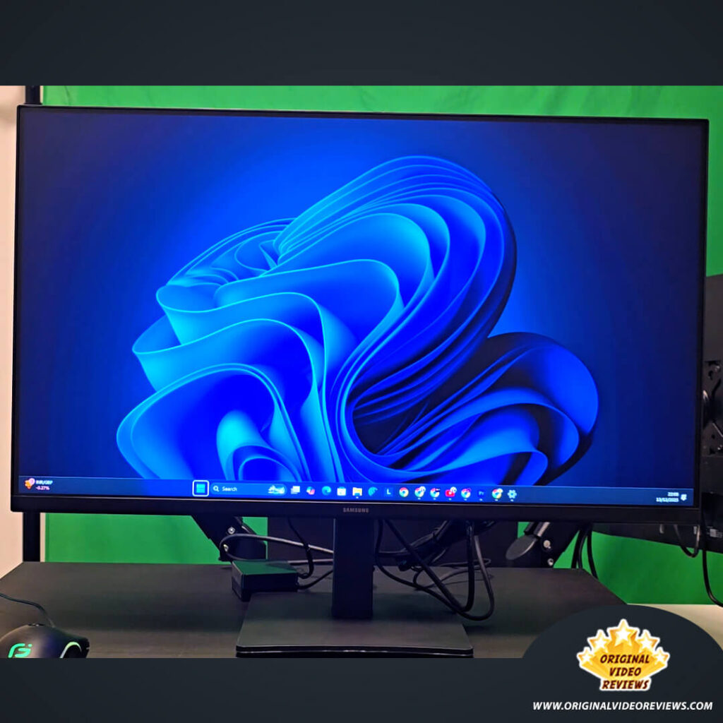 Front view of the Samsung Essential Monitor S3 27-inch display powered on, showing the Windows 11 desktop wallpaper.