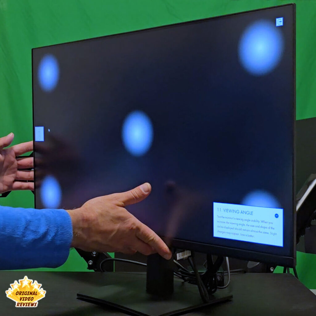 Samsung Essential Monitor S3 27-inch display performing a viewing angle stability test with circular patterns on a black background.