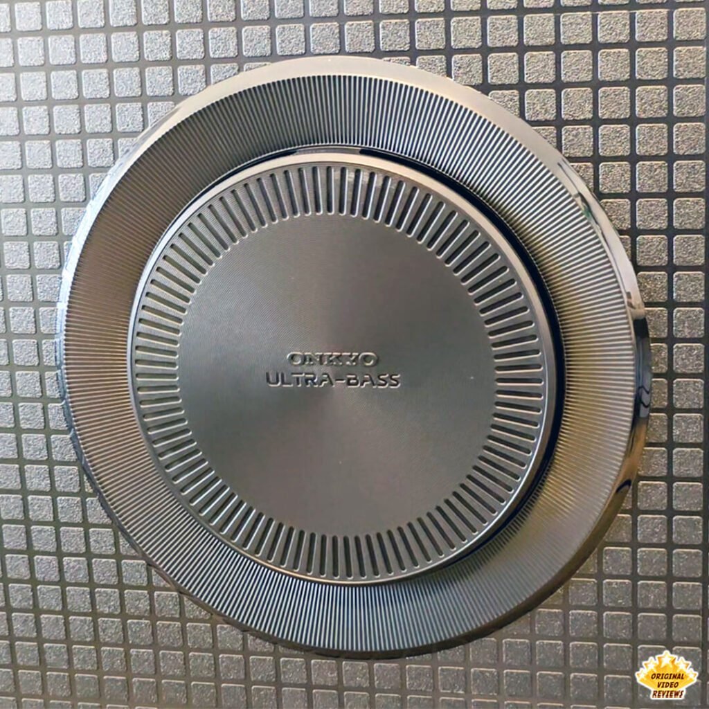 Close-up of the ONKYO ULTRA-BASS integrated subwoofer on the rear panel of the TCL P89K 65-inch 4K QLED TV, featured in a review by Original Video Reviews.