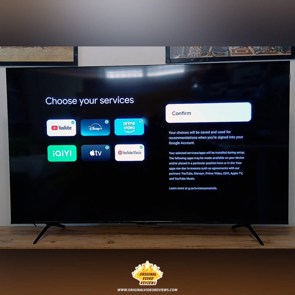 "Choose your services" screen on Google TV during the setup of the TCL P89K 65-inch QLED TV, featuring apps like YouTube, Disney+, and Apple TV, part of a review by Original Video Reviews.