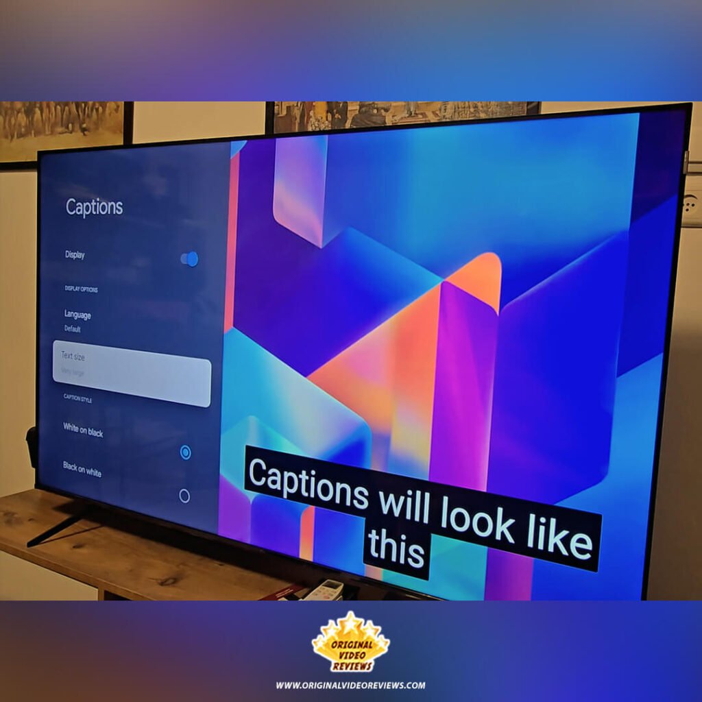 The "Captions" accessibility settings menu on the TCL P89K 65-inch QLED TV, showing a preview of "White on black" text, from a review by Original Video Reviews.