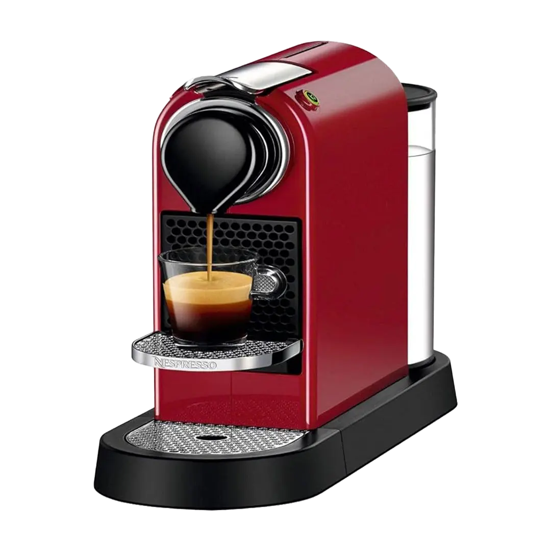 Red Nespresso CitiZ espresso machine brewing coffee into a clear glass on its folding metal cup support