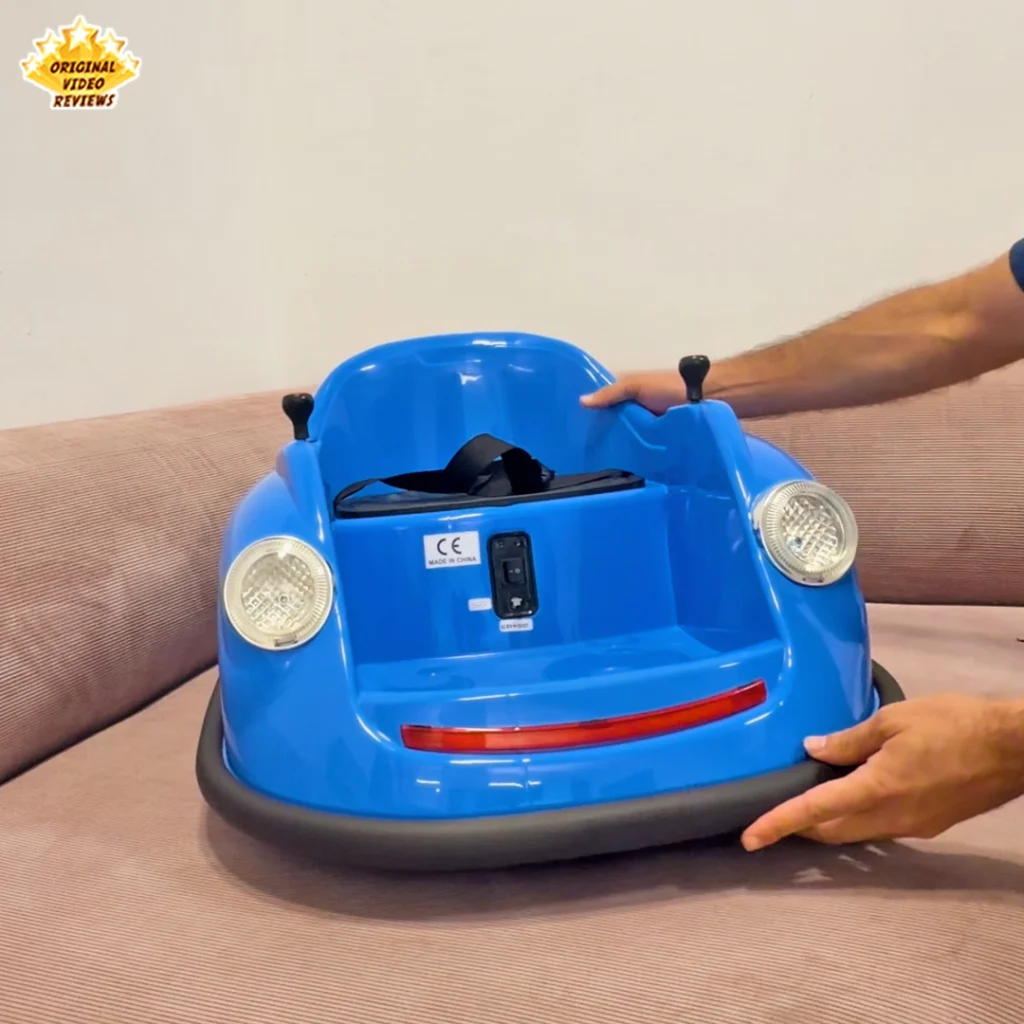 Close-up of the Electric Bumper Car for Kids showing the seat, black safety harness, CE label, and joystick knobs