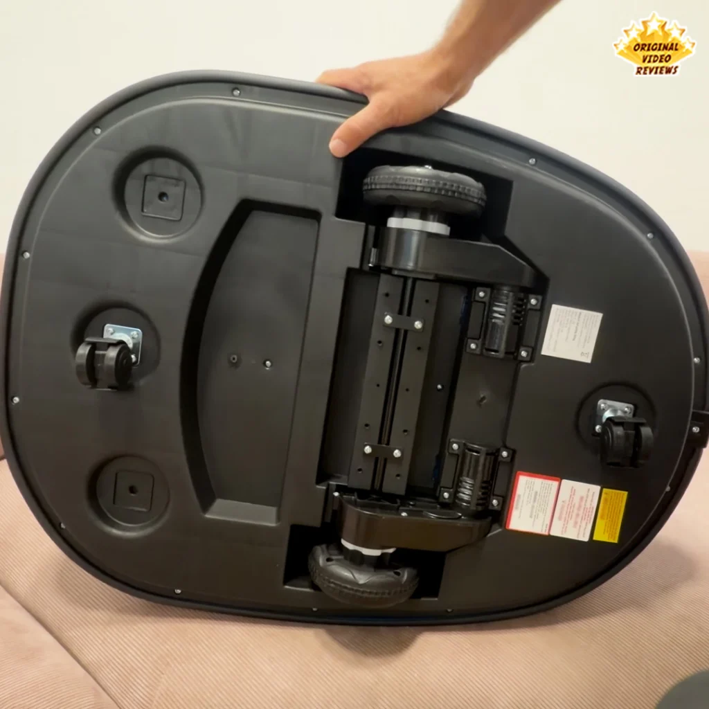 Underside of the Electric Bumper Car for Kids flipped over, showing the wheels and internal motor and gearbox mechanism