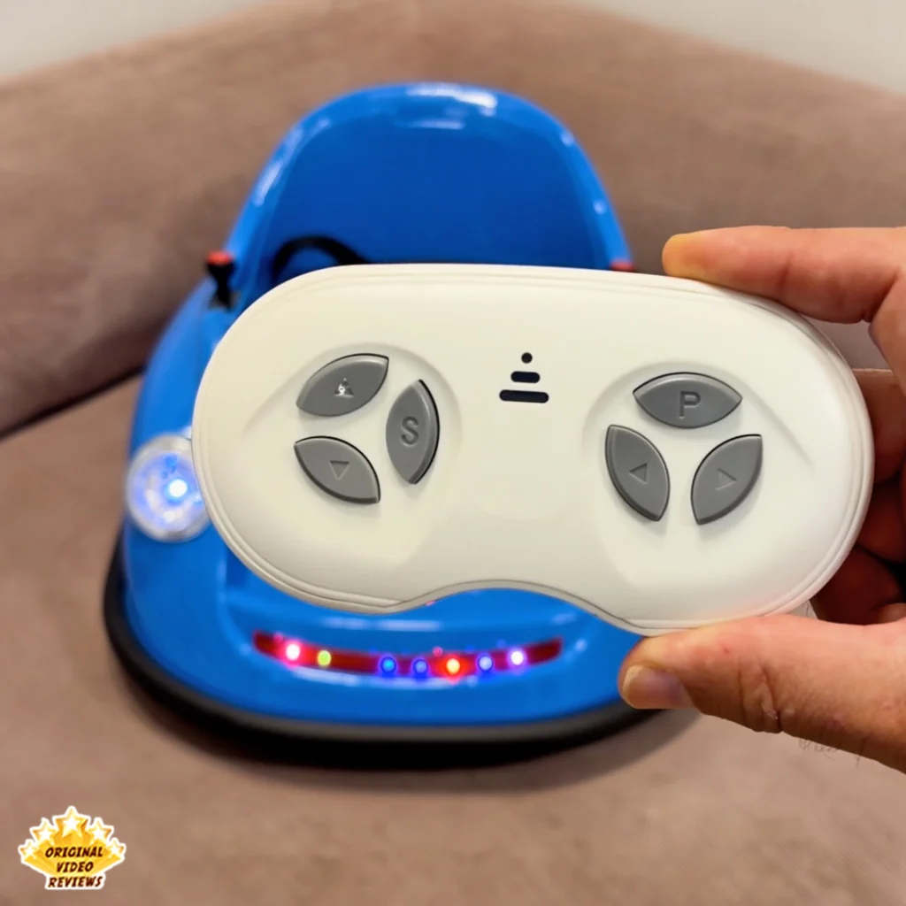 White wireless parent remote control for the Electric Bumper Car for Kids held in front of the car with its LED lights on