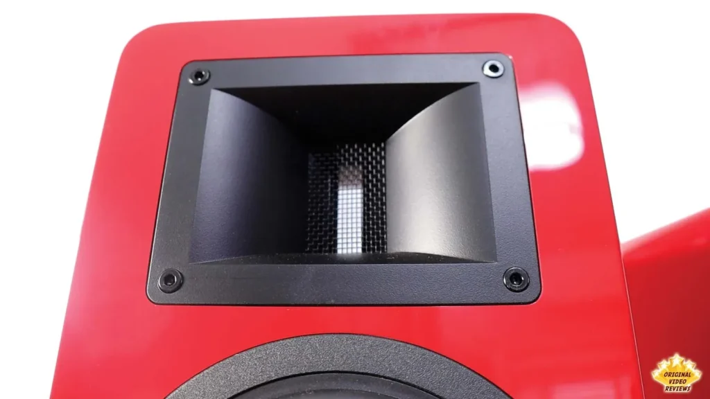 Close-up of the horn-loaded ribbon tweeter above the woofer of a red AIRPULSE A100 speaker