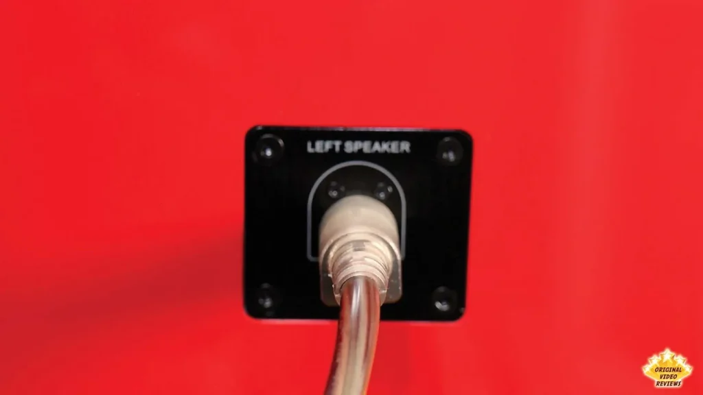 Cable plugged into the left speaker input on the back of the AIRPULSE A100