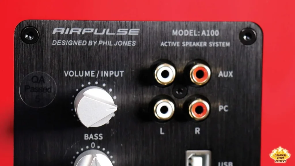 Rear panel of the AIRPULSE A100 active speaker with volume knob and AUX and PC RCA inputs