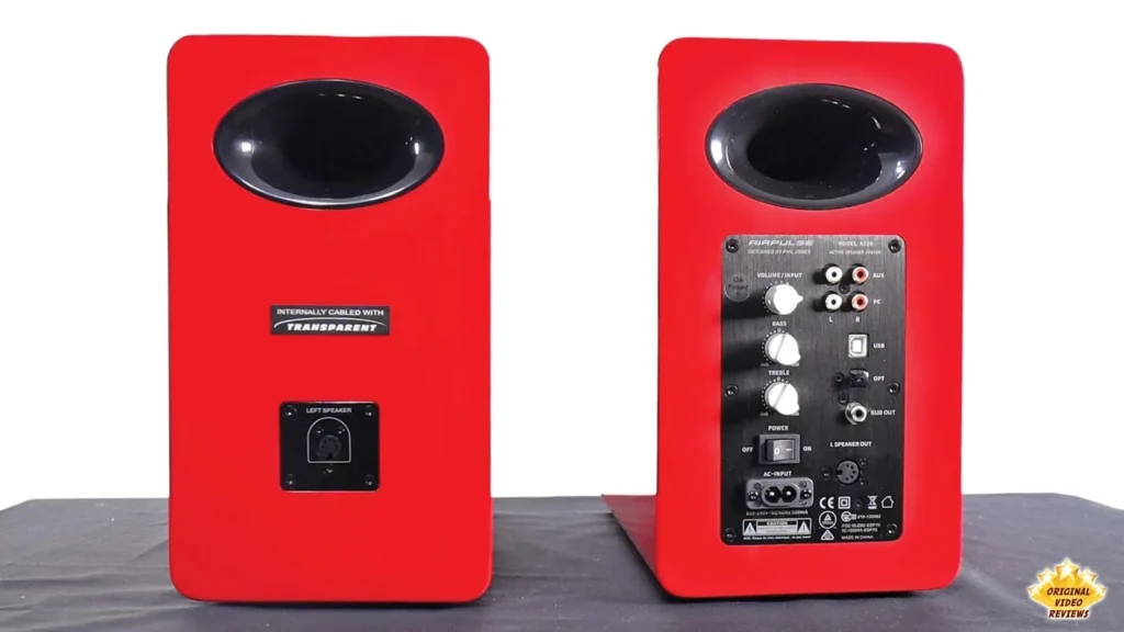 Rear of the two AIRPULSE A100 speakers, with the connection panel on the active speaker