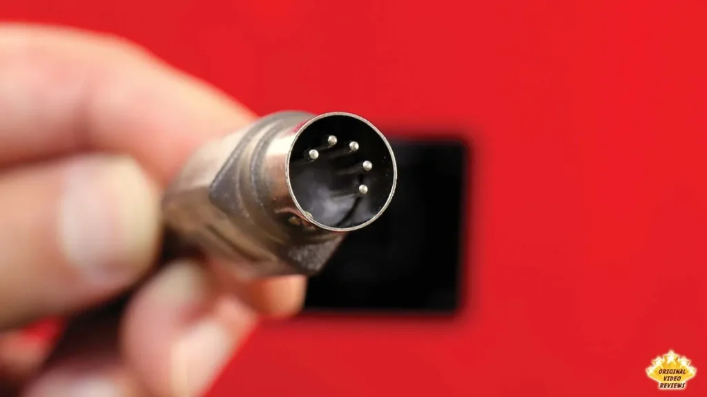 Close-up of the multi-pin connector on the AIRPULSE A100 speaker connecting cable