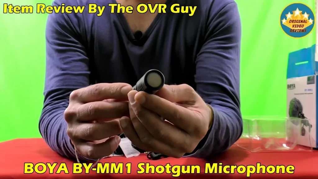 The BOYA BY-MM1 microphone held in both hands
