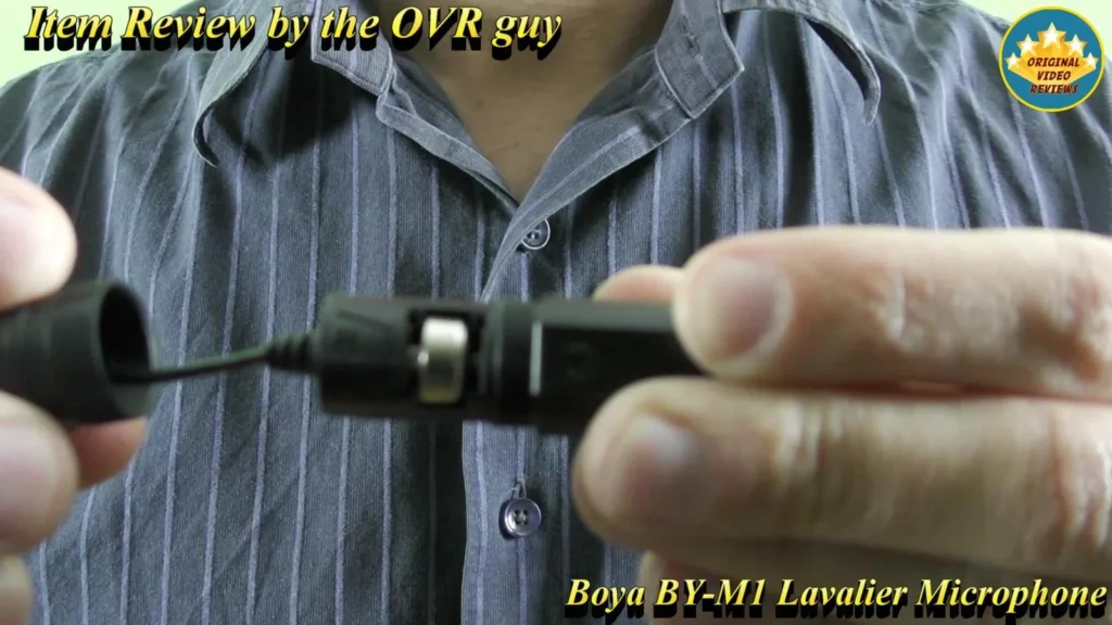 Close-up of a BOYA BY-M1 Lavalier Microphone cable end held in hand