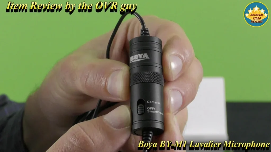 Close-up of the BOYA BY-M1 Lavalier Microphone control capsule held in hand