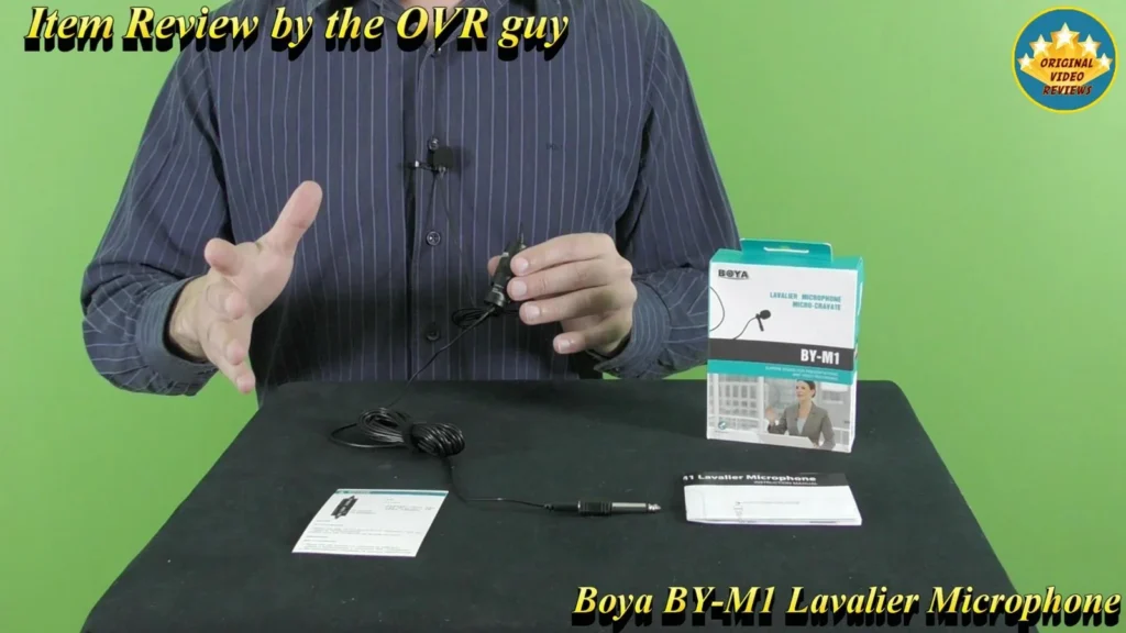 BOYA BY-M1 Lavalier Microphone retail box, user manual and accessories on the table