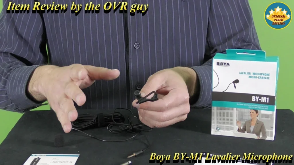 BOYA BY-M1 Lavalier Microphone retail box and the microphone held in hand