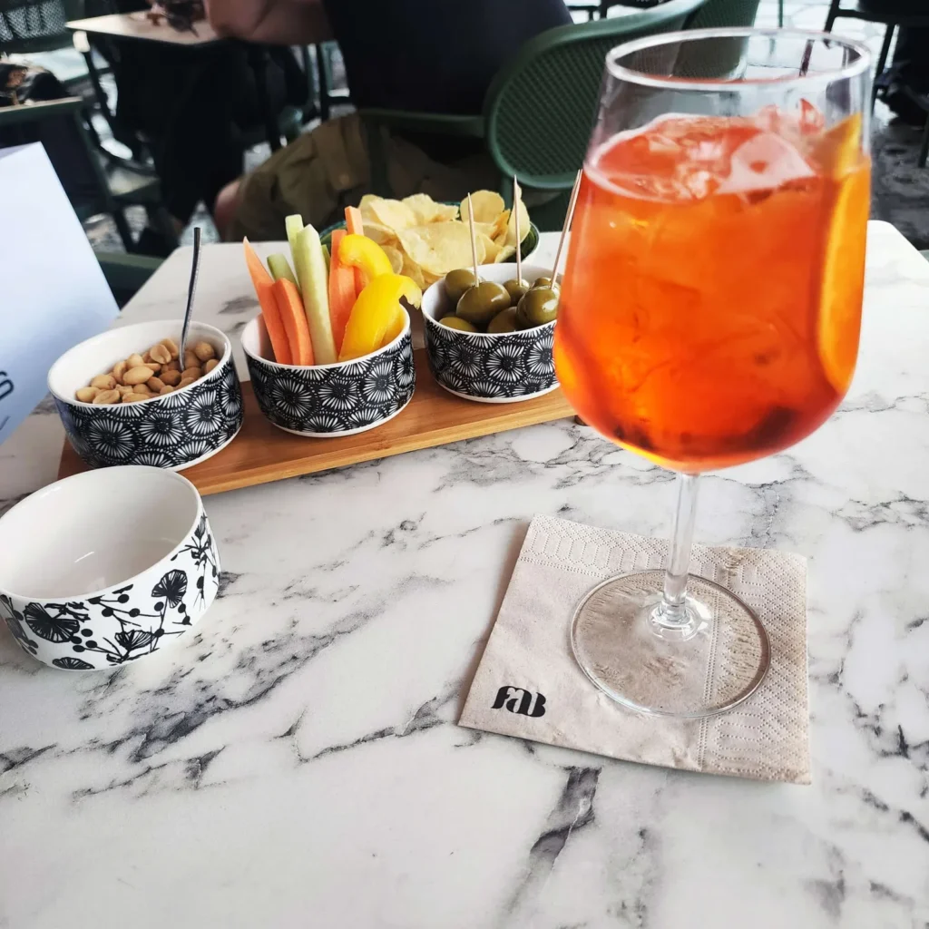 Aperol Spritz on a marble table at FAB in Milan