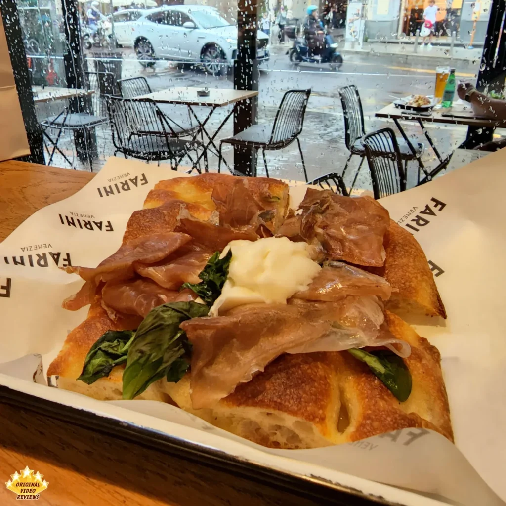 Square pizza with mozzarella and meat at Farini in Milan
