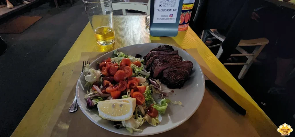 Beef with salad and a beer on the side at Historical Rotisserie 35 in Milan