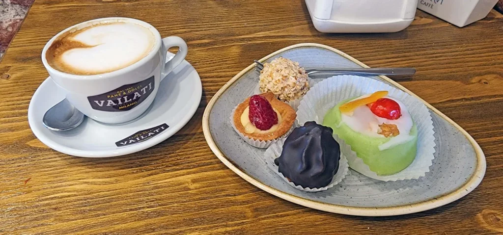 Cappuccino with four sweets and pastries at Bakery Pastry Di Lorenzo Vailati (Panificio Storico Vailati) in Milan